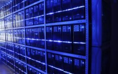 Rows of servers in a data center, representing the health information systems behind telemedicine and eHealth.