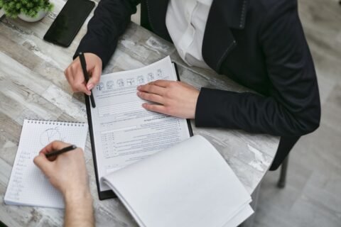 Professionals reviewing quality audit documents