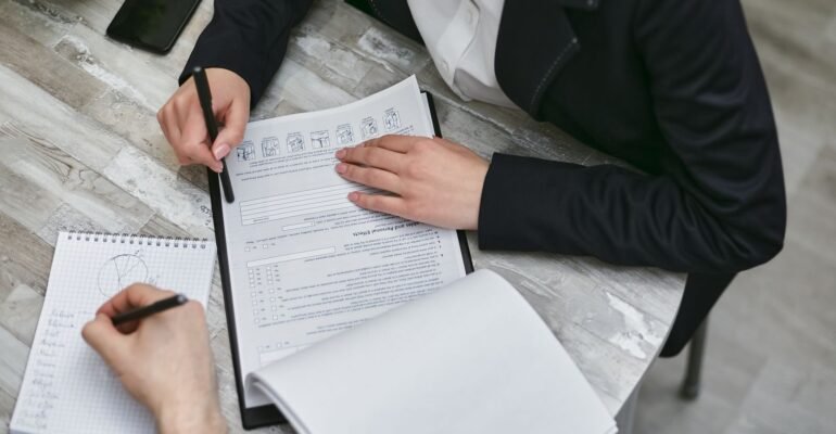 Professionals reviewing quality audit documents