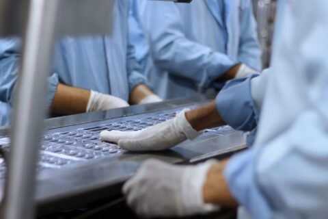 Workers in a medical device and pharmaceutical facility