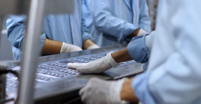 Workers in a medical device and pharmaceutical facility
