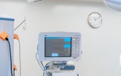 Patient monitor beside a hospital bed