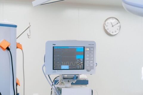 Patient monitor beside a hospital bed