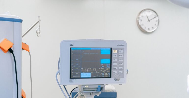 Patient monitor beside a hospital bed