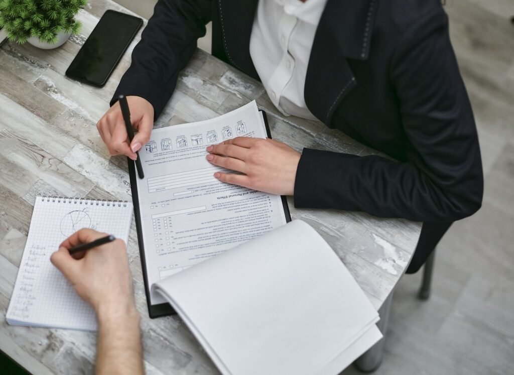 Professionals reviewing quality audit documents